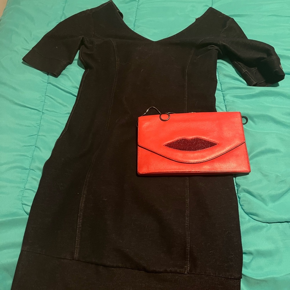 European mini dress. Fun long back zipper. Can be easily styled up or down.